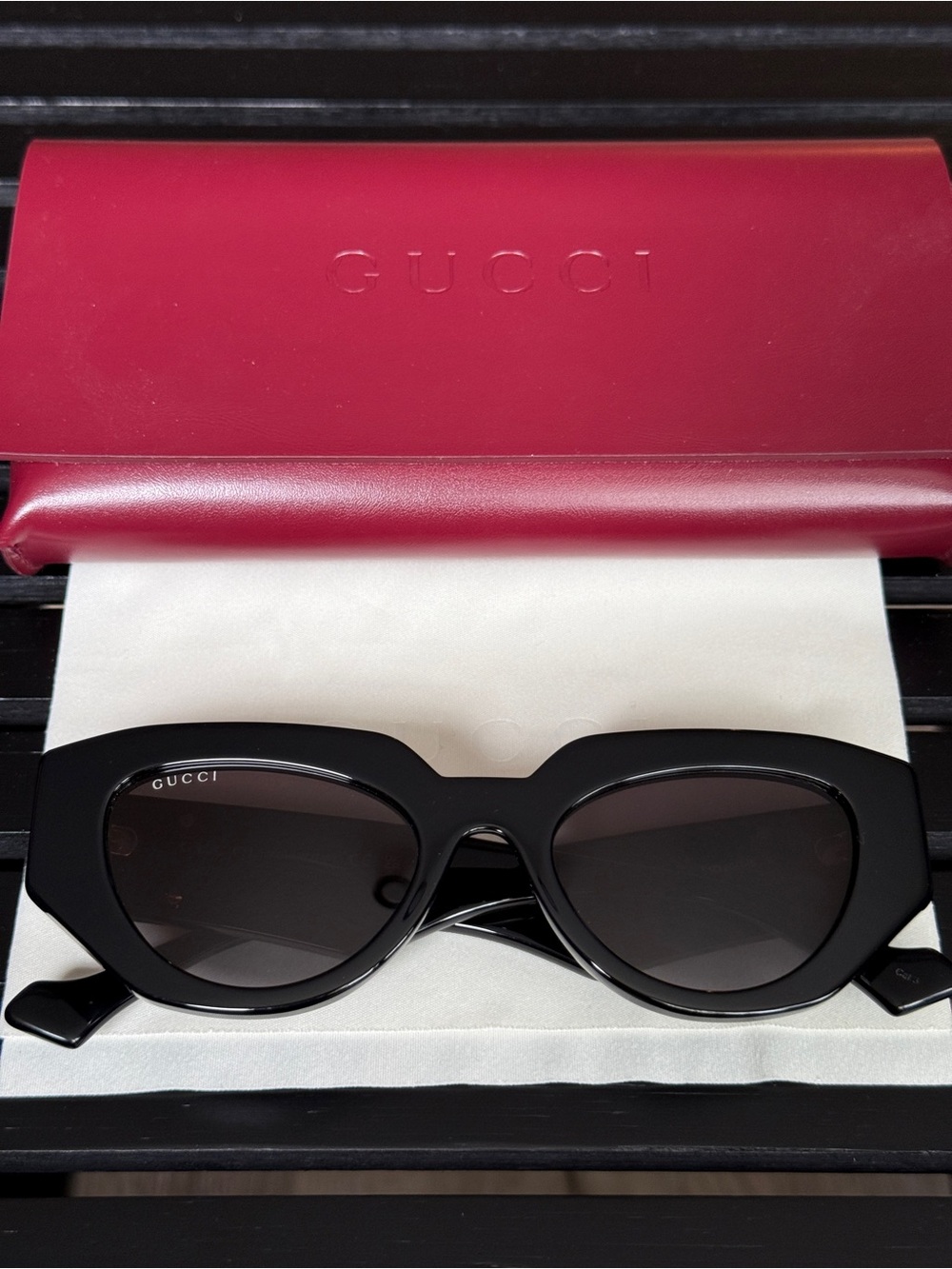 Gucci Black Oval Women's Sunglasses with Dark Lenses
